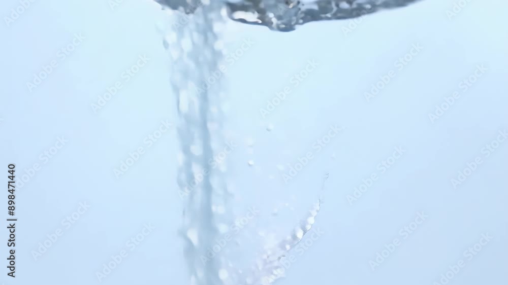 Poster a drop of water falls creating splashes and waves against a light background. concept: refreshment a