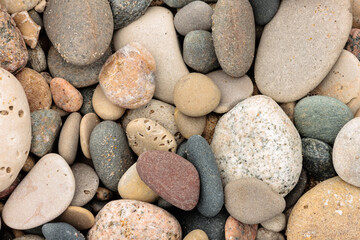 Small stones accumulated along the beach at Kohler Andrae State Park, Sheboygan, Wisconsin