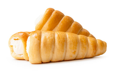 Side view of puff pastry cream horns in stack isolated on white background with clipping path