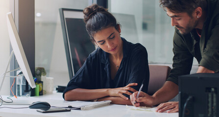Man, woman and teamwork at desk for project, planning and helping with notes in office. Business,...