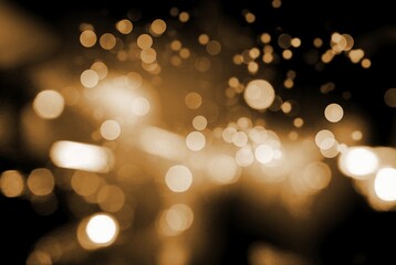 Golden light bokeh of blurred brilliance.