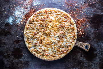 Bolognese Pizza served in wooden board isolated on dark background top view of italian fastfood