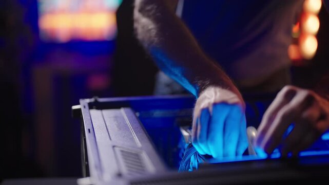 Person remove big graphic card GPU from gaming computer case 4K
