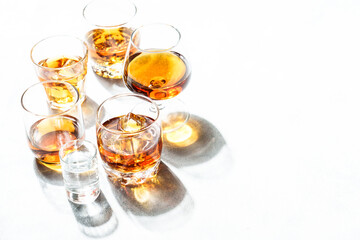 Strong alcohol drink. Cognac, whisky, rum, tequila at white background.