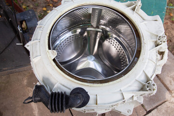 Disassembling the washing machine drum to replace the cross. Washing machine breakdown and repair,...