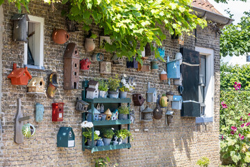 Diversity of colorful bird houses at little old fishing house in Oosterend wadden island Texel in...