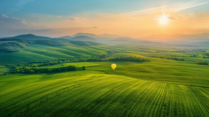 Green Field With Mountains in Background