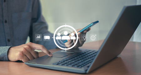 Business marketing position concept, businessman holds dart board icon with arrows for customer...