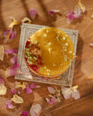 Handmade beeswax candles decorated with flowers and herbs. Beautiful handmade candle. Relaxation atmosphere. Luxurious lifestyle. Selective focus