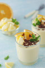 Orange lemon citrus milk mousse in glasses	