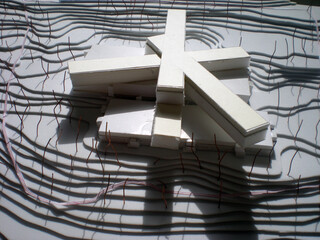 Architectural building models with topography made of foam board and illuminated