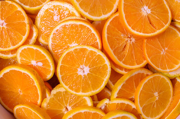 slices of citrus fruits - oranges Orange fruit pattern. Healthy food background