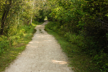 A gravel multi-use shared hiking and biking trail along the lake within the Pike Lake Unit, Kettle Moraine State Forest, Hartford, Wisconsin