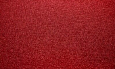 Fototapeta premium close-up of a red fabric with a textured surface.