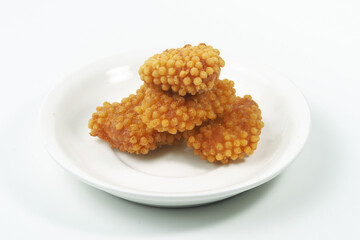 Fried bubble crispy crumb chicken nuggets on white plate isolated on white background, isolated