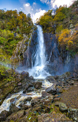 waterfall in autumn forest