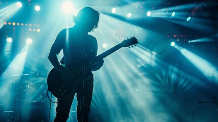Obraz premium Guitarist playing with passion on a vibrant stage