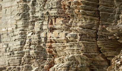 Eroded rock face with intricate layers and unique textures