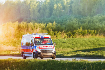 Emergency vehicle traveling through rural area © AlexGo