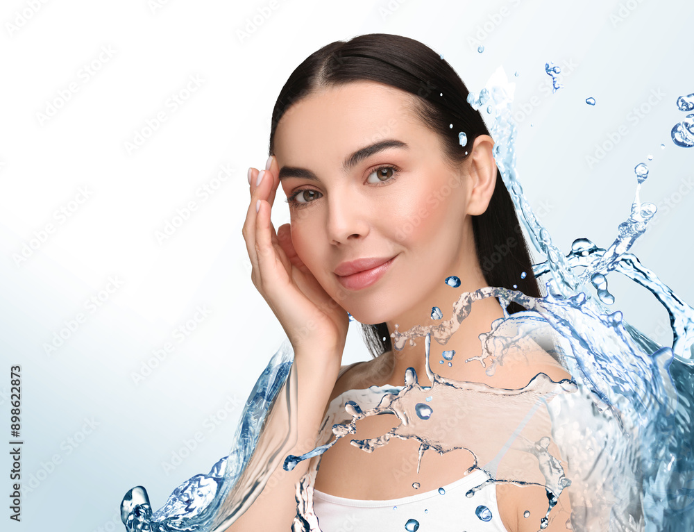 Wall mural beautiful woman and splashes of water on gradient background