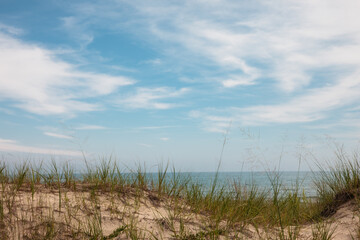 The view of Lake Michigan under an August cloudy sky from behind the protective sand dunes at Kohler-Andrae State Park, Sheboygan, Wisconsin