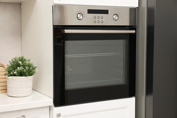 New electric oven in kitchen. Cooking appliance