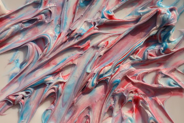 An abstract pattern of thick paint, mixing colors create a sense of movement. Artistic texture