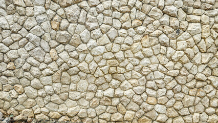 The walls are made of beautiful patterned stone.