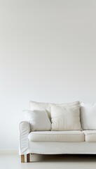 A white sofa sits in front of a white wall in a modern interior. The sofa has three pillows and a white slipcover. Generative AI