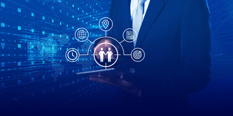 A businessman presents a global partnership concept, showcasing interconnected icons and strategies for business collaboration.