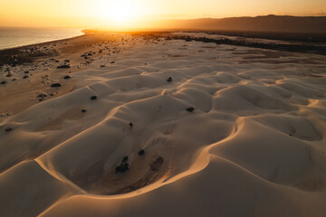 Zahek sand dunes seen from a drone view- golden sunset in Socotra Island.