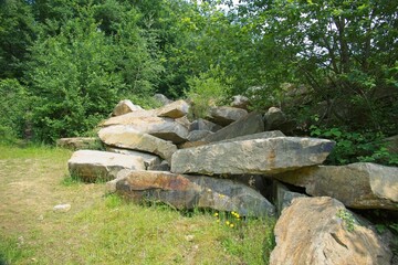 Large, disorderly stacked pieces of Bentheim sandstone at the quarry of the German village of Gildehaus.