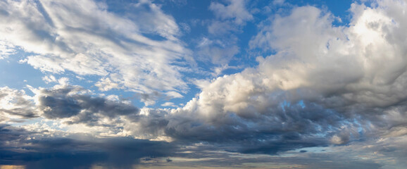 relief and expressive clouds after rain on a blue light sky
