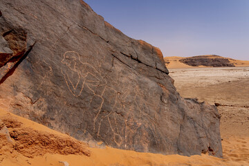 Obraz premium rock painting in desert, Bouhadian rocks in Tadrart Rouge, Tassili N'Ajjer National Park. Sahara
