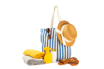 Beach accessories. Beach bag with hat, beach towel, sunglasses, spf cream and sandals isolated on...