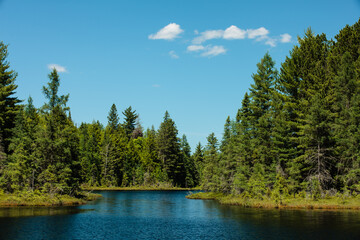 The distant entrance from the small area of Devils Lake to the larger lake, very close to the Michigan border in Vilas County, Wisconsin, on an early July afternoon.