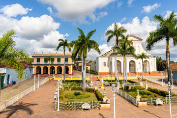 view of Plaza mayor parc in trinidad cuba wit palms and museum and colonial houses 