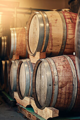 Barrels, wine cellar and storage of alcohol in distillery, manufacturing process and fermentation. Container, basement and factory for product in storehouse, vintage liquor and selection of beverage