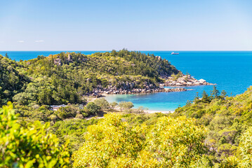 Picturesque golden sandy Arthur Beach with granite boulders and turquoise water on Magnetic Island,...