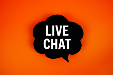 Live Chat text on speech bubble top view on orange background