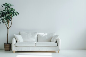 A white sofa sits in front of a white wall, with a potted plant next to it. Sunlight streams through a window, illuminating the room. Generative AI