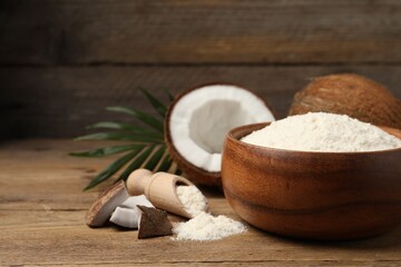 Coconut flour and fresh fruits on wooden table, closeup. Space for text