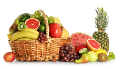 Many different fresh fruits in wicker basket isolated on white