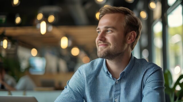 The smiling bearded man