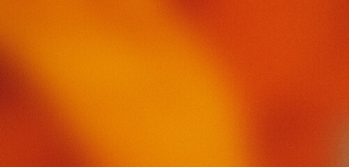 Grainy textured abstract background with orange and yellow gradient