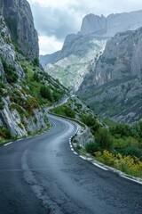 A serpentine road winds through a picturesque valley