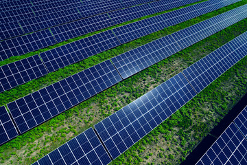 Solar panels park generating green energy electric.Green energy reduce carbon emissions and makes earth cleaner and more ecological.	
