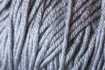 A close up of a gray yarn with a fuzzy texture