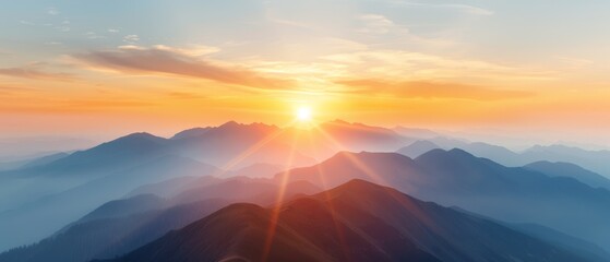  The sun sets over fog-covered mountains