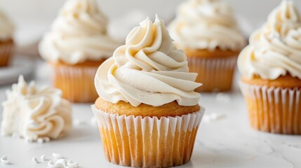Cupcakes with buttercream frosting on a white backdrop